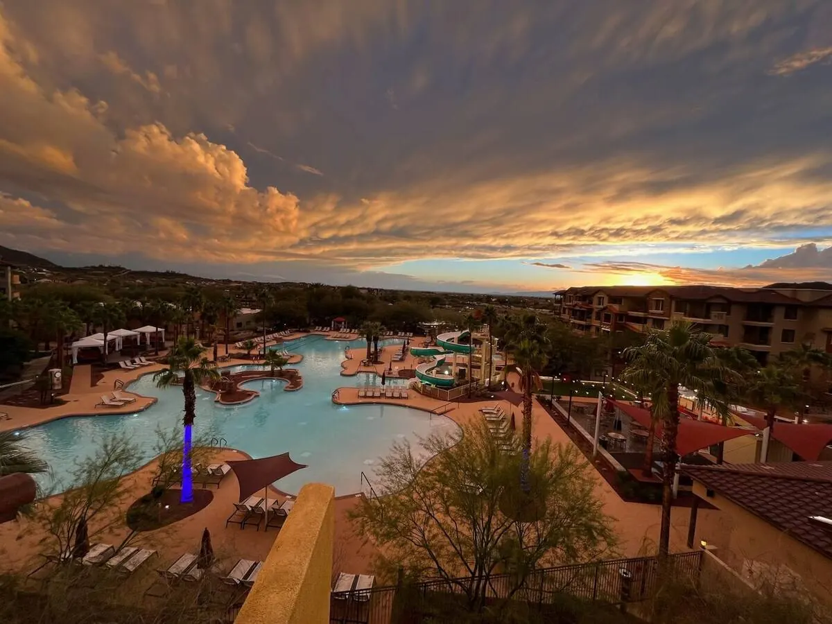 Resort pool at sunset